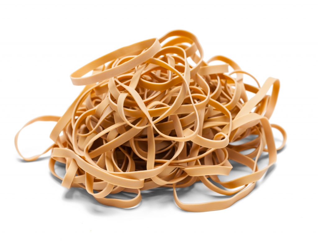 Rubber Bands in a Pile Isolated on a White Background.